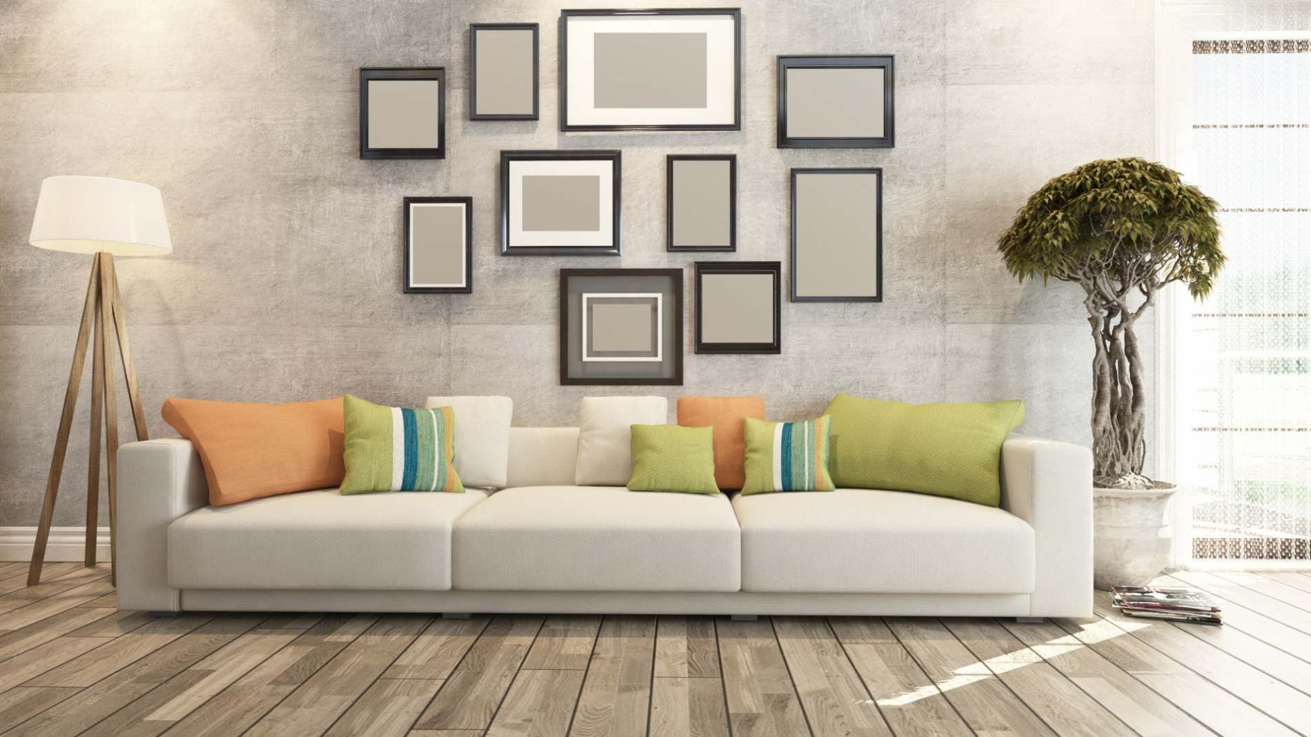 Living room wall of picture frames showing bespoke framing by Art Effects Southampton